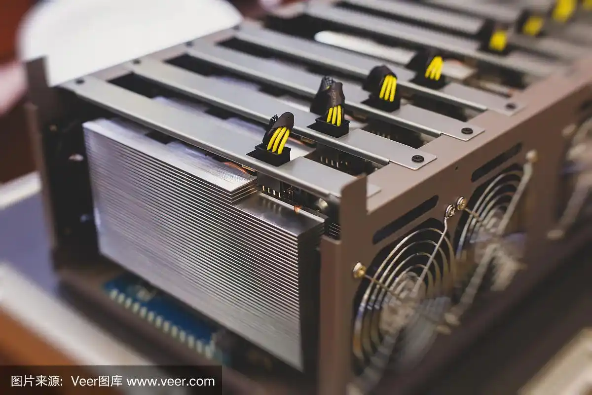 A close-up of a miner's hand adjusting the settings on a mining rig, symbolizing the active management required for successful cryptocurrency mining.